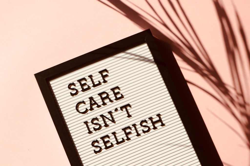 Photo frame with photo writing self care isn't slefish